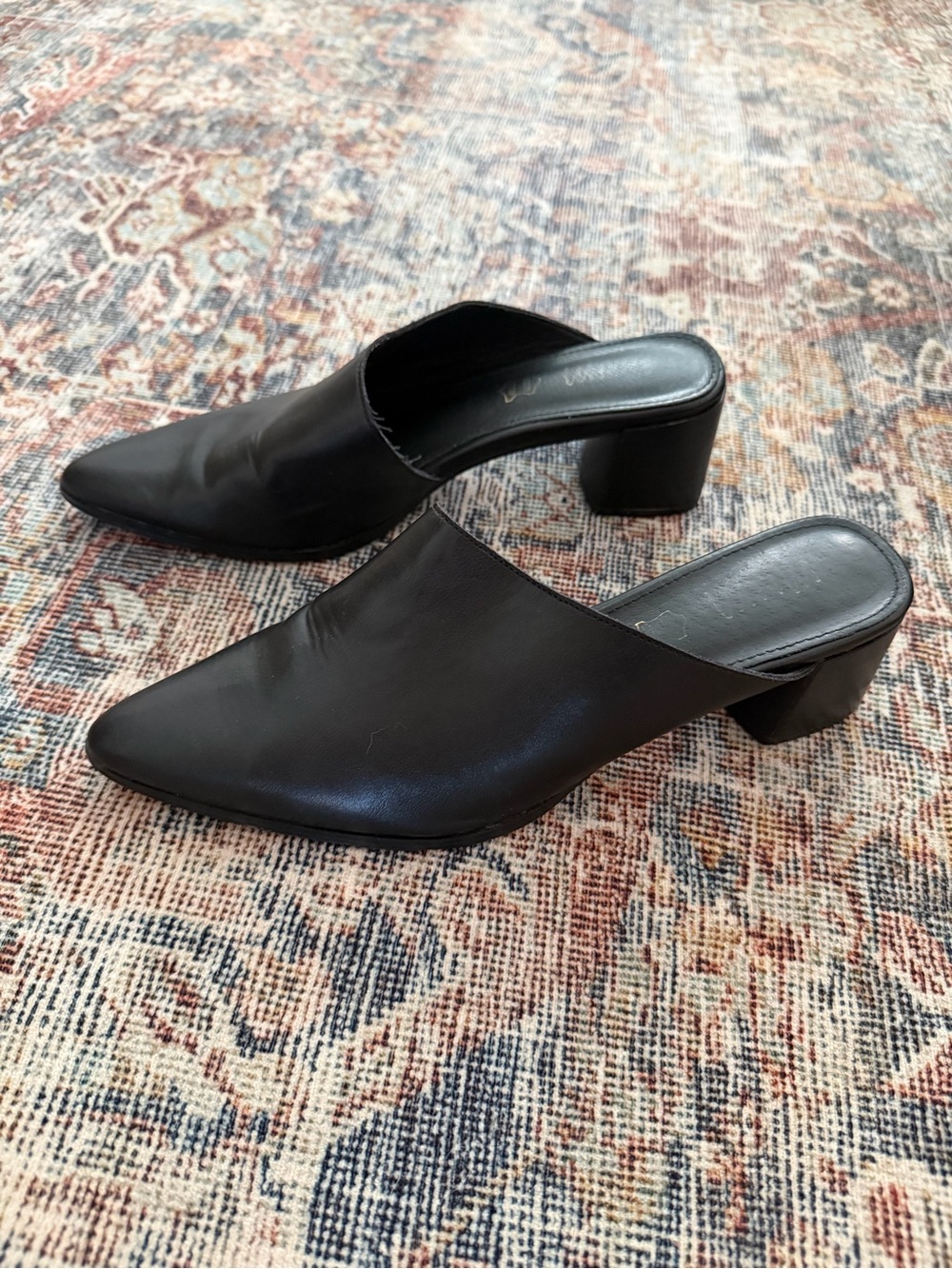 mi.im black leather asymmetrical pointy toe mules